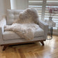 brown sheepskin rug on chair 