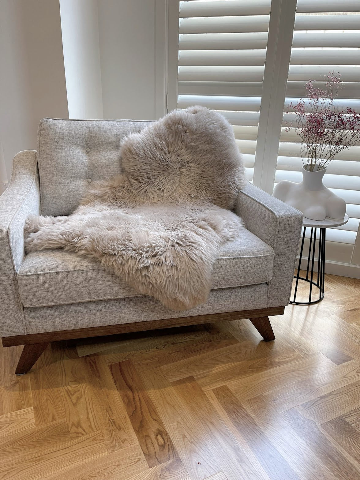 brown sheepskin rug on chair 