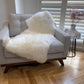 white sheepskin rug on lounge chair