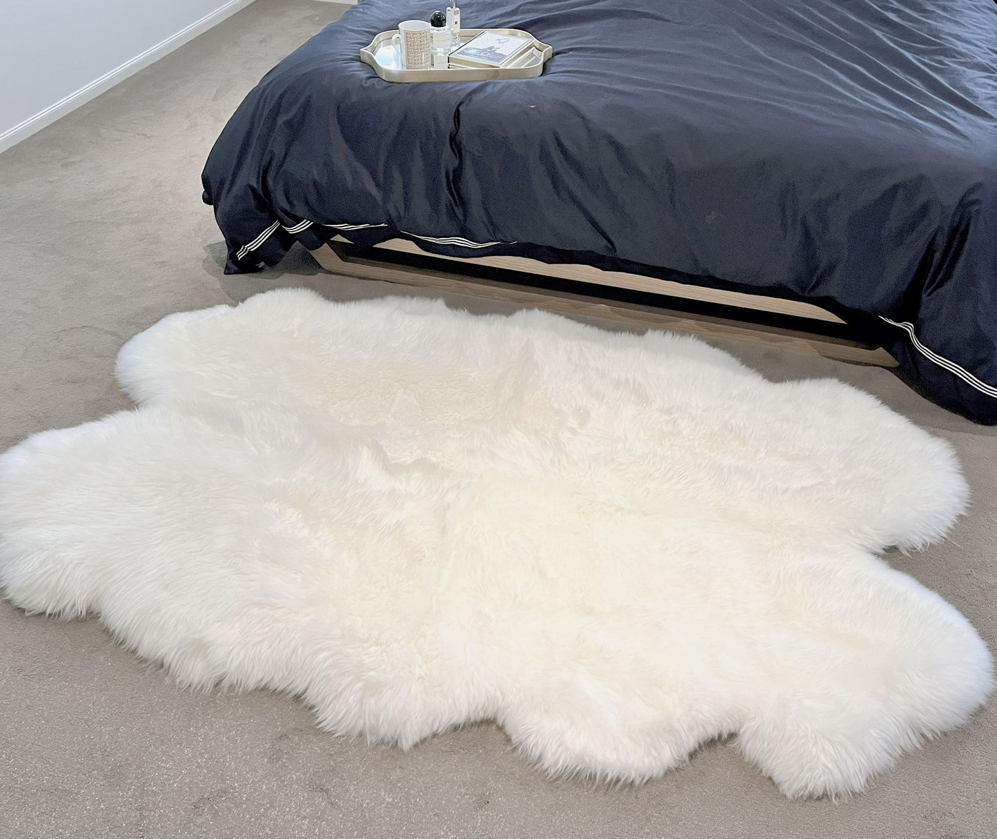 large sheepskin floor area rug on bedroom floor